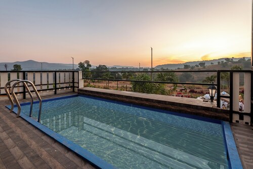 ELIVAAS White House 4BHK Villa With Pool