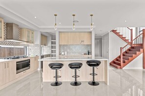 Fridge, microwave, oven, stovetop - Brand New Riverfront Home, Pool and Sunrise Views (Griffin)