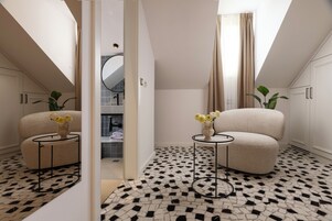 Attic Deluxe Room | Sengetøy av topp kvalitet, minibar, safe på rommet og blendingsgardiner