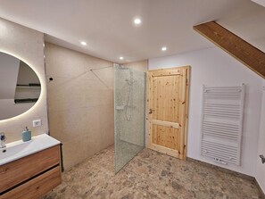 Shower, hair dryer, soap, toilet paper