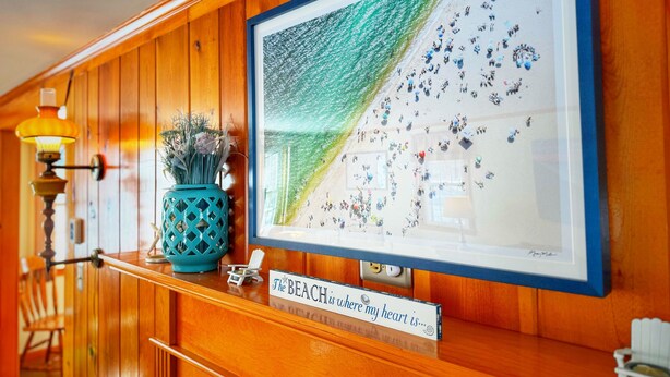 A framed artwork of a beach scene with a sign below stating "The BEACH is where my heart is..." - New Seabury Getaway | Perfect Leaf Peeping! (Mashpee)