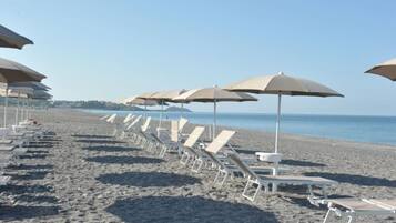 Private beach, white sand, beach shuttle, beach bar