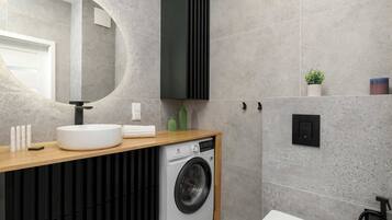 Dusj, hårføner, håndklær og sjampo