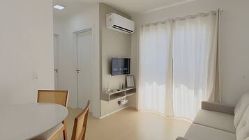 Apartamento conforto | Área de estar | TV de tela plana