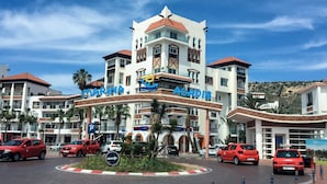 A multi-story hotel with a prominent sign reading "MARINA AGADIR". - Apartment agadir bay flat luxe (Agadir)