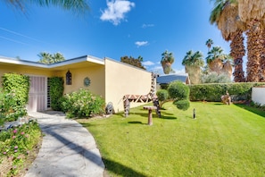 A house with a paved driveway, a well-maintained lawn, and a decorative horse statue. - 4 Mi to Indian Wells Tennis: Home w/ Mtn Views! (Palm Desert)
