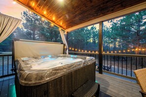 Outdoor spa tub - Intentional comfort meets laid-back cabin fun (Broken Bow)