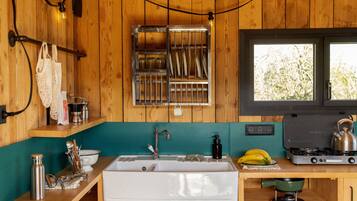 Mini-fridge, stovetop, cookware/dishes/utensils