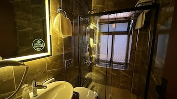 Standard Double Room, Courtyard View | Bathroom | Shower, hair dryer, towels, toilet paper