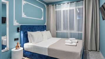 Deluxe Room, City View | Premium bedding, minibar, in-room safe, desk