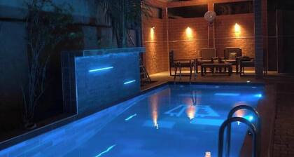 Private suite: bedroom, living room and kitchen near the beach