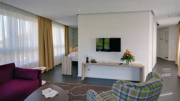 Suite, Balcony, City View | In-room safe, desk, iron/ironing board, free WiFi