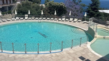 Indoor pool, seasonal outdoor pool, pool umbrellas, sun loungers