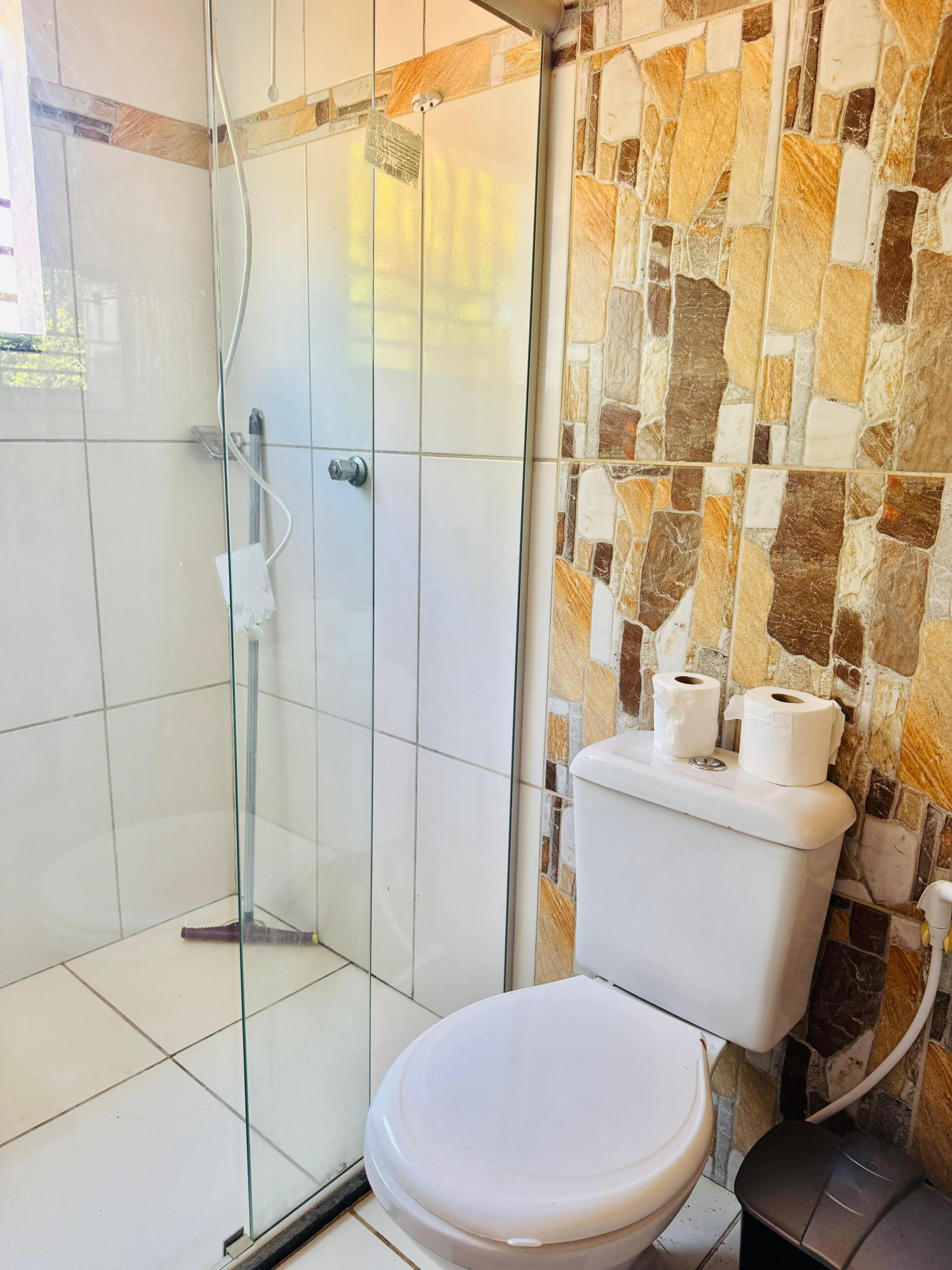 Basic Studio | Bathroom | Shower, towels, toilet paper