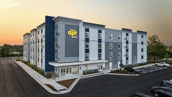 A modern hotel building with a sign reading 'stay apt suites.' - stayAPT Suites Yuma (Yuma)