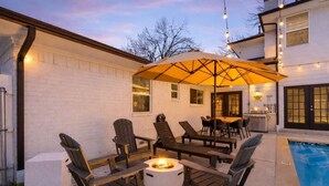 An outdoor patio with a fire pit, seating area, and a pool. - 6BD/3.5BA Modern Rustic Retreat | Yard, Pool & BBQ (Richardson)