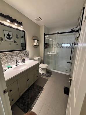 Shower, hair dryer, towels, soap