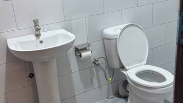 Standard Single Room, City View | Bathroom | Shower, towels, soap, toilet paper