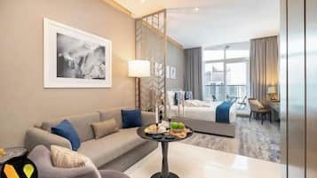 Luxury Studio, Balcony, Canal View | Living area | 55-inch Smart TV with cable channels