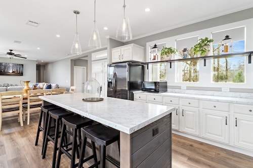 MEGA is a beautiful 3 Bedroom, 2.5 Baths home with private hot tub on 300 acres.