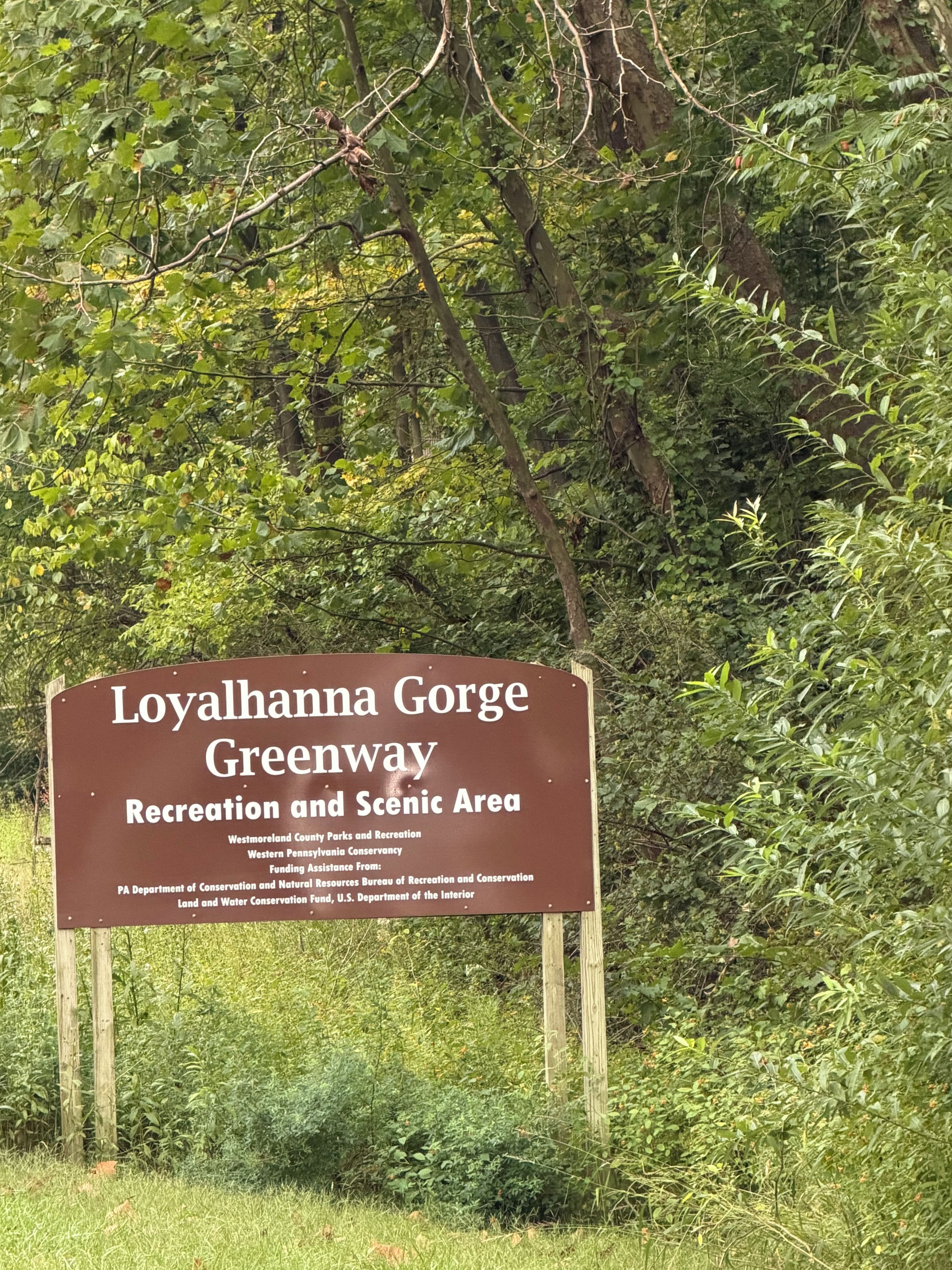 A sign for Loyalhanna Gorge Greenway, indicating it is a recreation and scenic area.