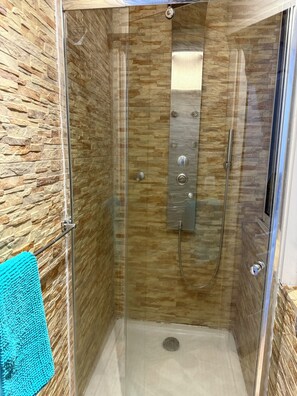 Shower, hair dryer, towels, soap