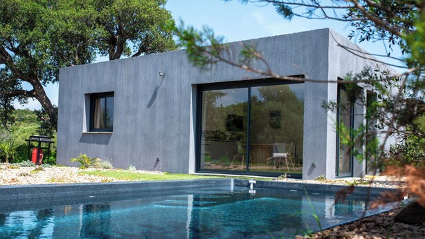 A modern house with a swimming pool, large glass windows, and a minimalist design. - VILLA NEPITA Modern 1-bedroom with private pool (Porto-Vecchio)