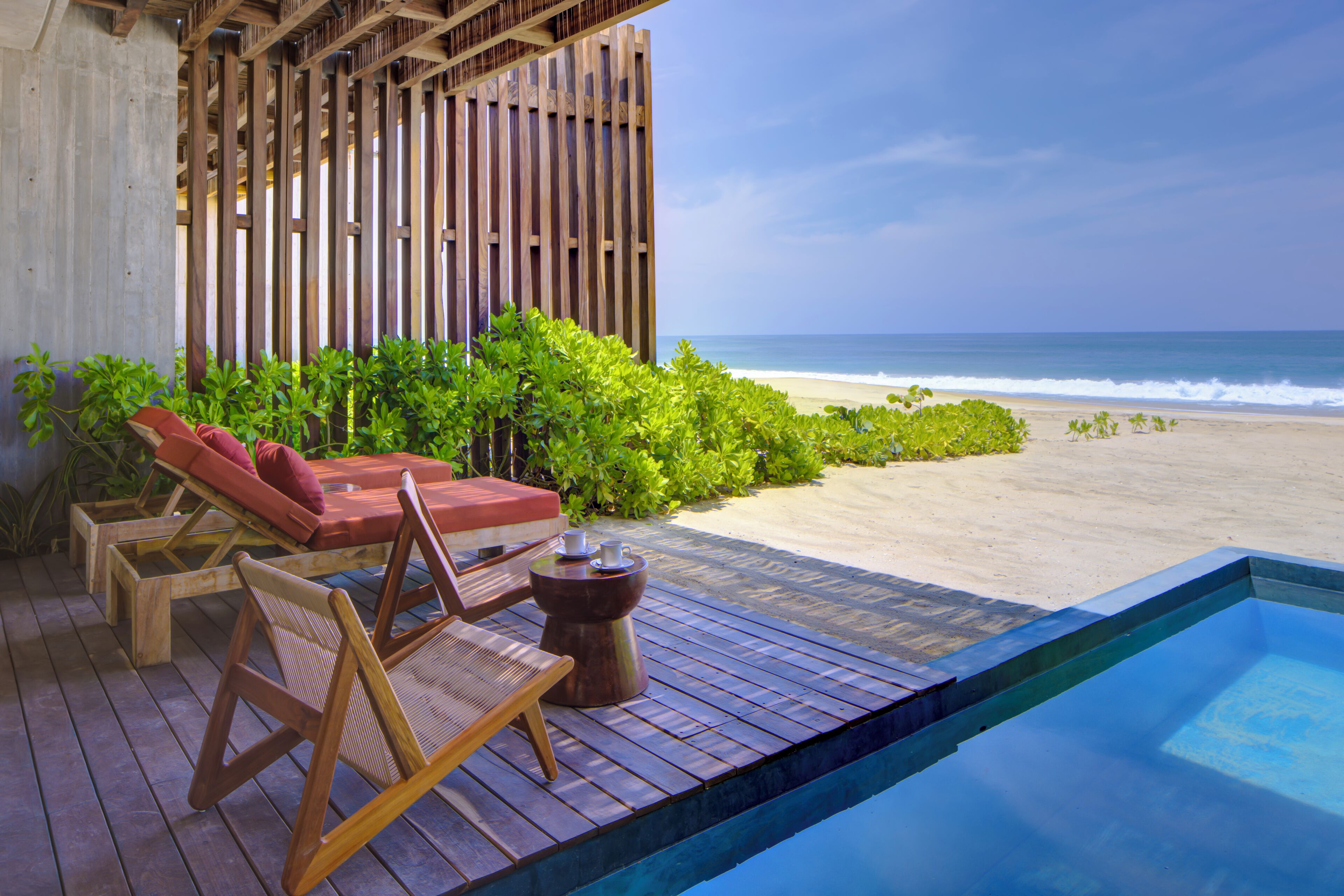 Deluxe Villa, Private Pool, Beachfront | Living area | 65-inch Smart TV with digital channels, streaming services