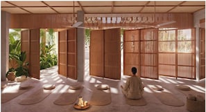 A room with tatami mats, a person meditating, bamboo partitions, and a ceiling fan. - NANANA Hotel del Mar (Puerto Escondido)