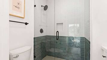 Shower, hair dryer, towels, shampoo
