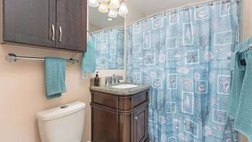 Shower, hair dryer, towels, shampoo