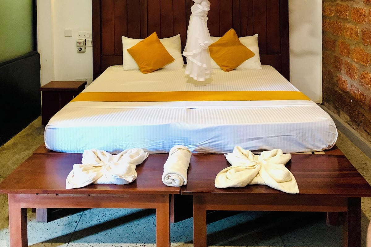 デラックス ダブルまたはツインルーム バルコニー ガーデンビュー | デスク、ノートパソコン用作業スペース、アイロン / アイロン台