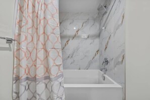 Shower, hair dryer, towels, shampoo - Bright 1BR Basement Suite Near U of A (Edmonton)