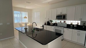 Fridge, microwave, oven, stovetop - South Facing, prime lake front home, 10 minutes from Walt Disney World® Resort! (Kissimmee)