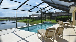 A heated pool - South Facing, prime lake front home, 10 minutes from Walt Disney World® Resort! (Kissimmee)