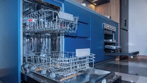 A modern kitchen with a built-in dishwasher, an oven, and a microwave. - Deluxe 2-bed  Walk to Cali's Best Dining 103 (Cali)