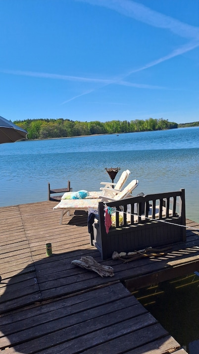 Cozy vacation home on Lake Lübbesee with terrace, garden and jetty on the lake