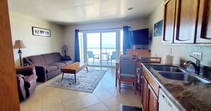 Living area - Condo #203 with beautiful sunset view from your balcony overlooking the ocean (Lincoln City)