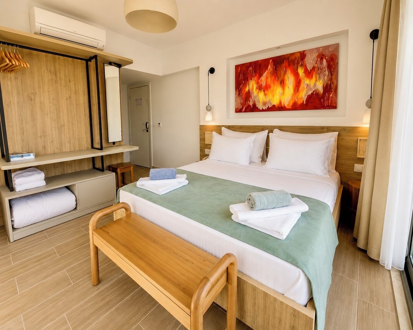 A hotel room with a bed, a bench, a wardrobe, and a painting.