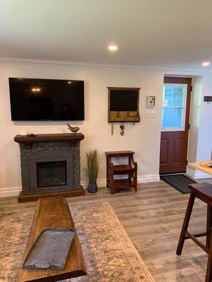 TV, fireplace - The Trinity Guest Suite, Trinity Guest House (Trinity)