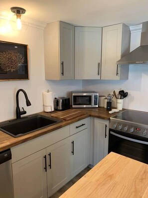 Fridge, microwave, dishwasher, toaster - The Trinity Guest Suite, Trinity Guest House (Trinity)