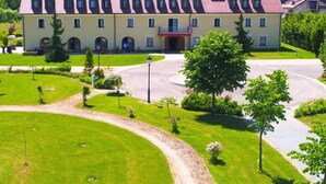 A large building with a symmetrical facade, multiple windows, and a central entrance. - Jurjevec Castle - Standard room 6 (Brezane Lekenicke)