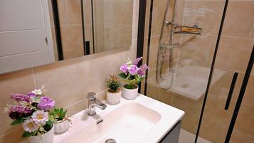 Shower, hair dryer, towels, soap