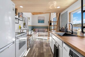 Fridge, microwave, oven, stovetop - Lakefront Tiny Home w/ Hot Tub + Sunset Views (Maitland)