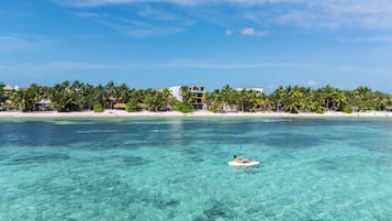 On the beach, sun loungers, beach towels