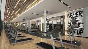 A modern gym with treadmills, weight machines, and a large motivational poster. - Grand Swiss-Belhotel Harbour Bay (Batam)