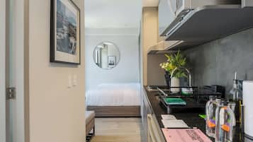 Apartment (LC) | Private kitchen | Microwave, stovetop, cookware/dishes/utensils