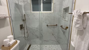 Shower, hair dryer, towels, toilet paper