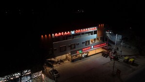 A two-story building with a sign for 'CSK Comforts Room' and 'Olumbus Restaurant'. There is a 'Juice Shop' sign visible. - CSK Comforts (Tumkur)
