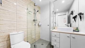 Shower, hair dryer, towels, soap